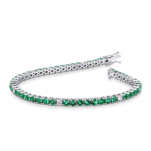 Bracciale tennis filo in oro bianco 18k con smeraldi e diamanti